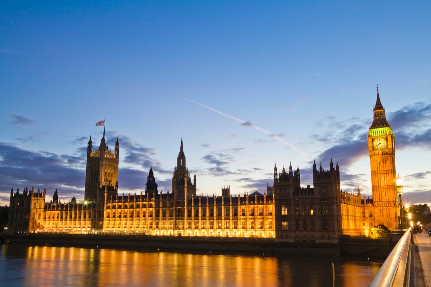 The Palace of Westminster beside the River Thames at dusk