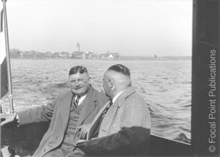 Roehm on boat, lake